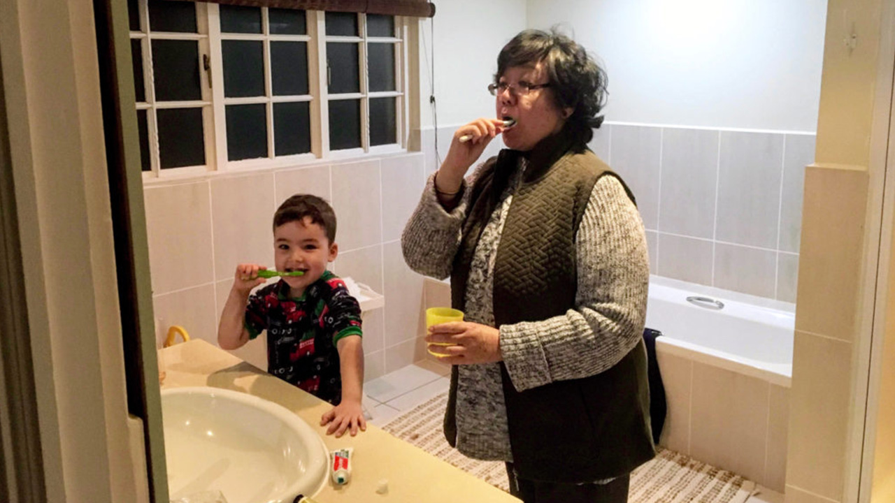 Zach and gogo practice brushing teeth
